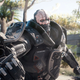 Adam Smasher is pointing his wrist gun at the camera, preparing to shoot you (or rather, your player character, V).
